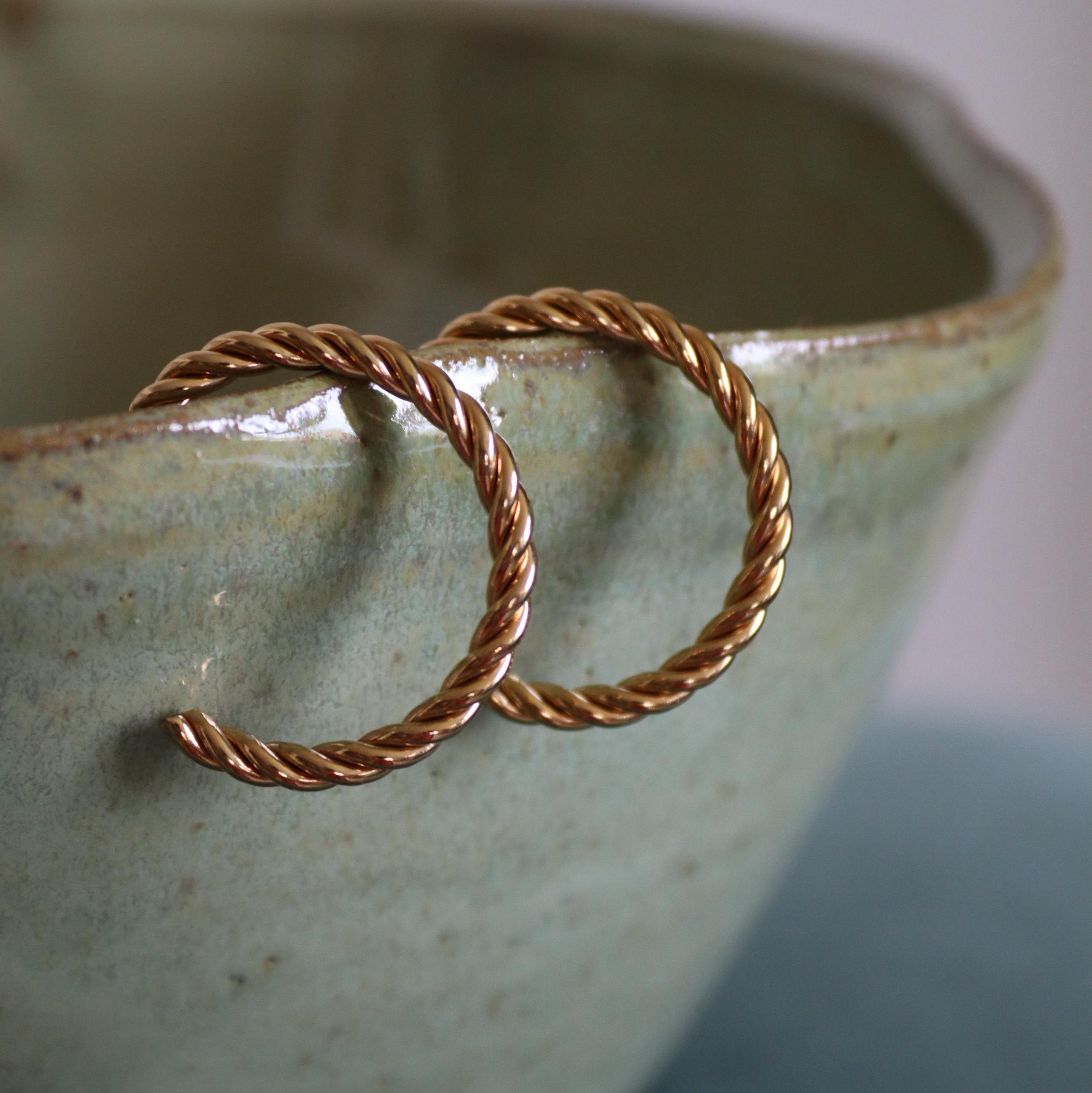 Two gold hoop earrings 